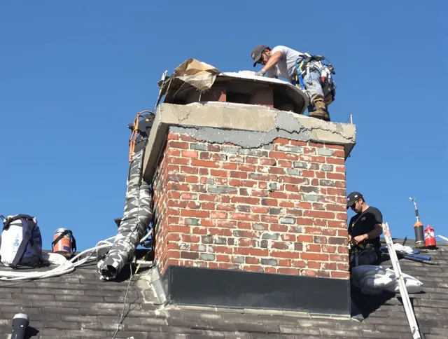 Pembroke Pines Chimney Sweep installing a custom chimney crown in Pembroke Pines, FL
