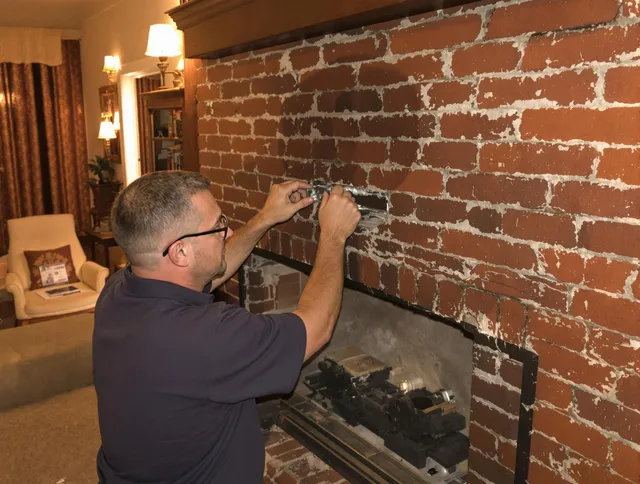 Pembroke Pines Chimney Sweep expert fixing a fireplace in Pembroke Pines, FL